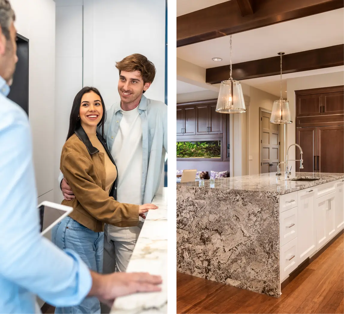 Smiling couple viewing kitchen with marble island